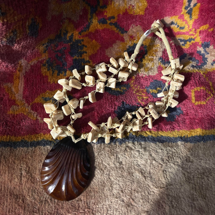 VINTAGE NECKLACE BONE WITH RESIN MEDALLION